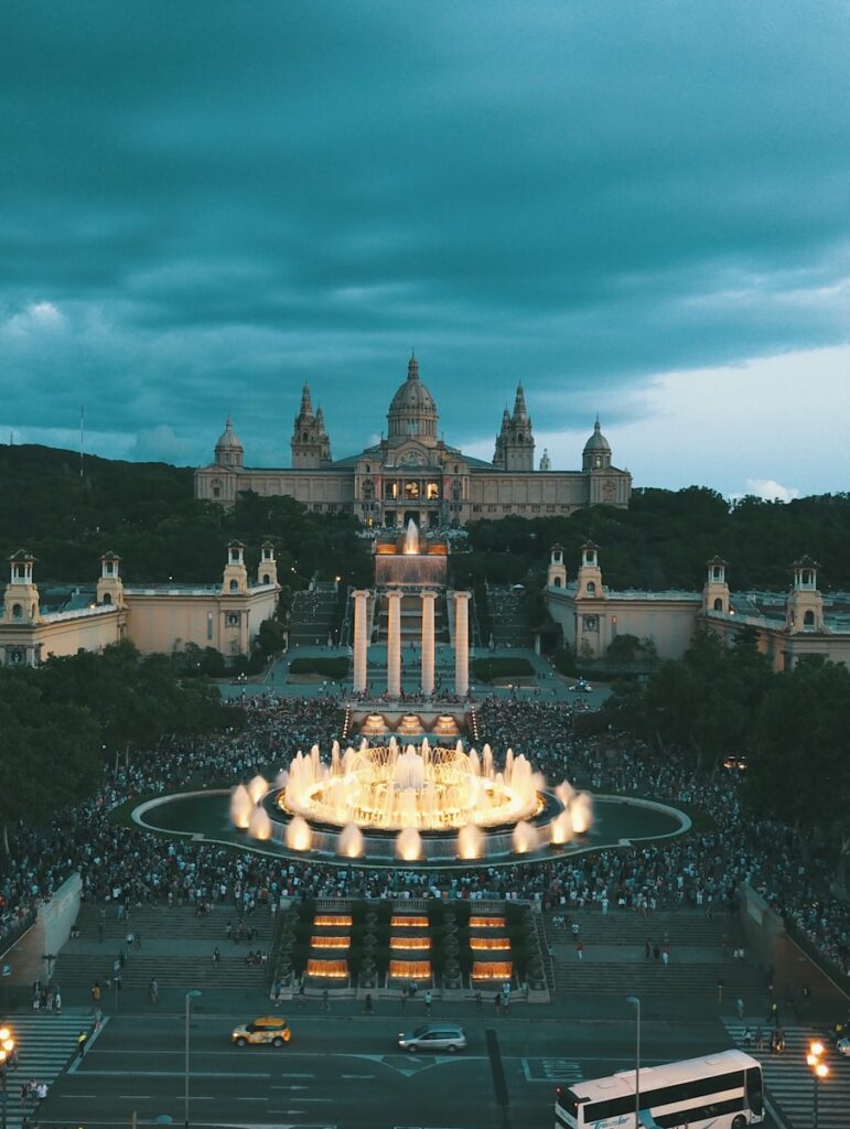 lighted water fountain in front of palace